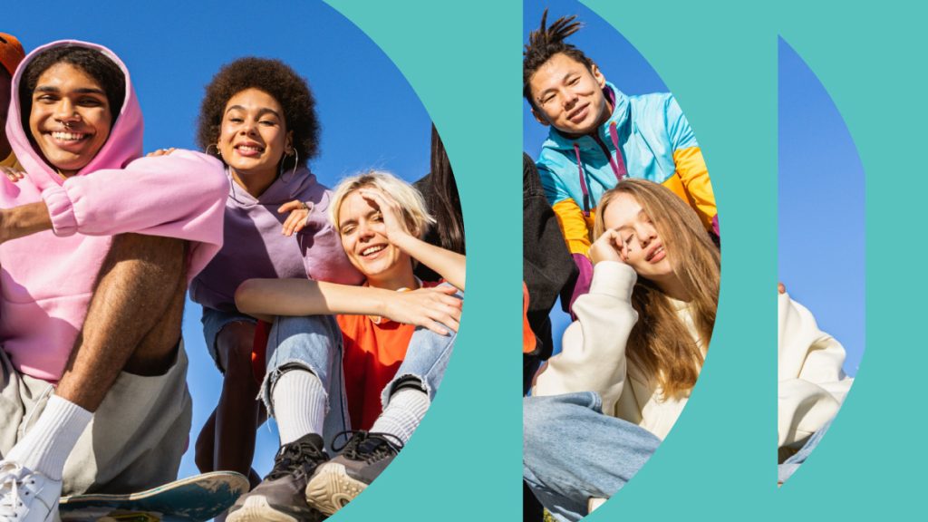 Group of diverse young people in colorful clothing smiling.