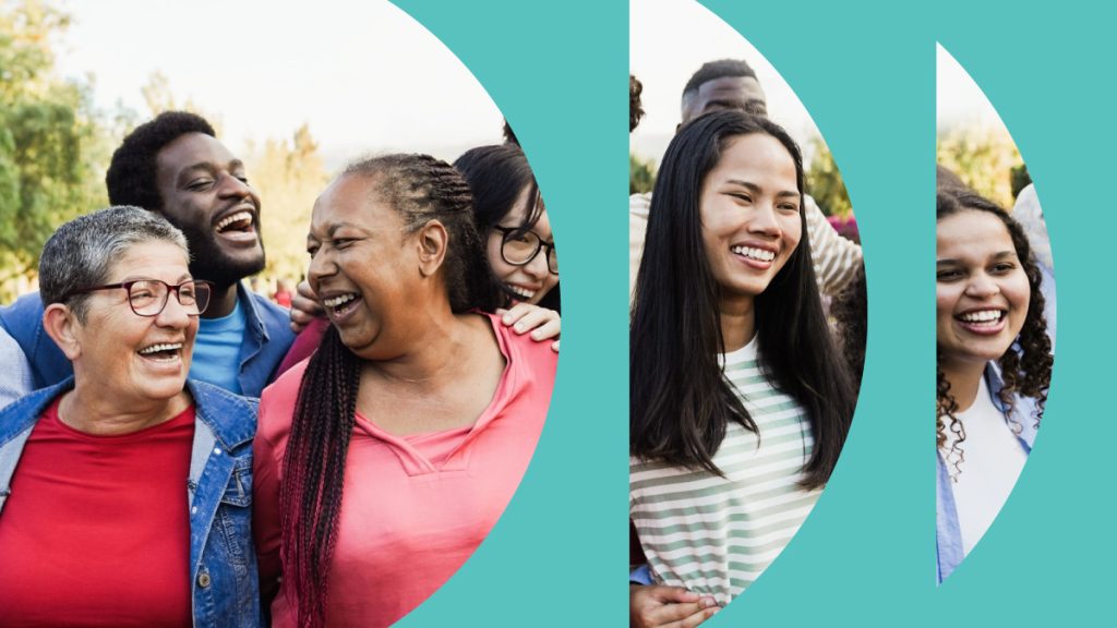 Diverse group of people hugging and smiling.