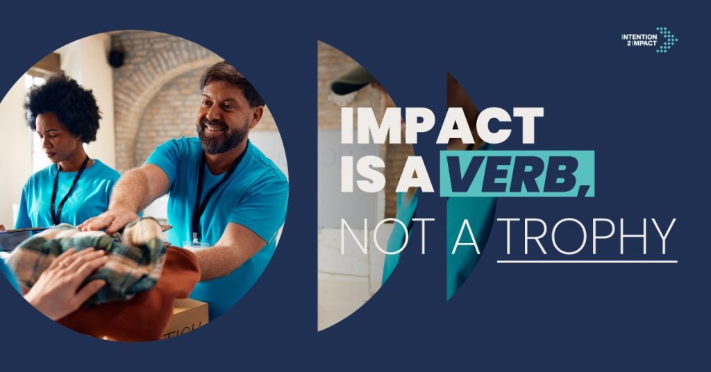 "Impact is a Verb, Not a Trophy" campaign graphic featuring two volunteers in matching teal shirts handing out donated clothing, with the Intention 2 Impact logo.